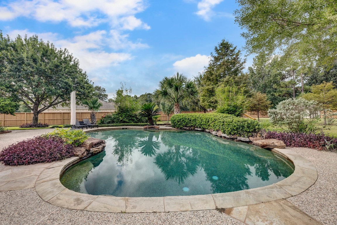 2600 Silverstone Way Conroe, TX 77304 - Photo 42 of 49 a view of a swimming pool with a yard