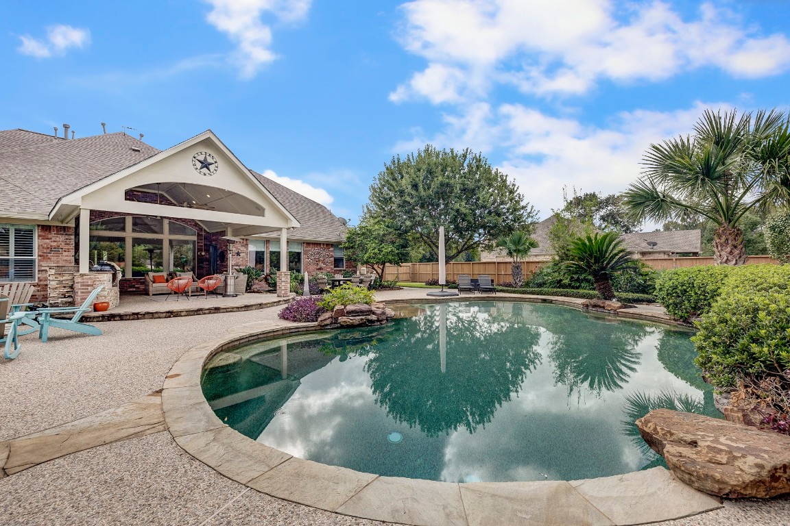2600 Silverstone Way Conroe, TX 77304 - Photo 43 of 49 a view of a house with swimming pool and sitting area