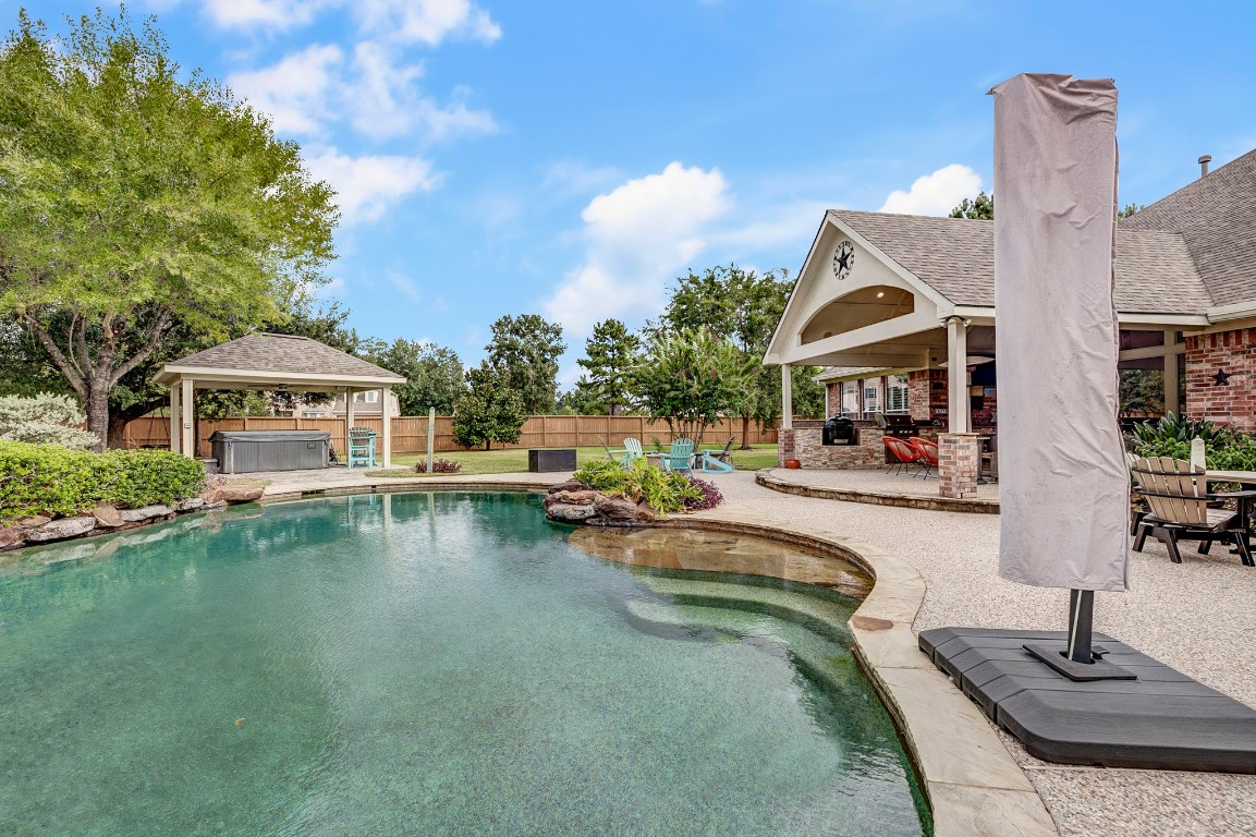 2600 Silverstone Way Conroe, TX 77304 - Photo 46 of 49 a view of a house with swimming pool and sitting area
