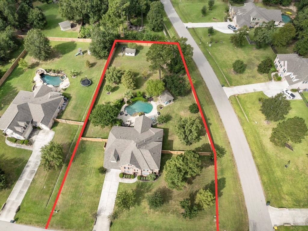 2600 Silverstone Way Conroe, TX 77304 - Photo 48 of 49 A luxurious corner lot with max privacy and easy access to neighborhood streets.