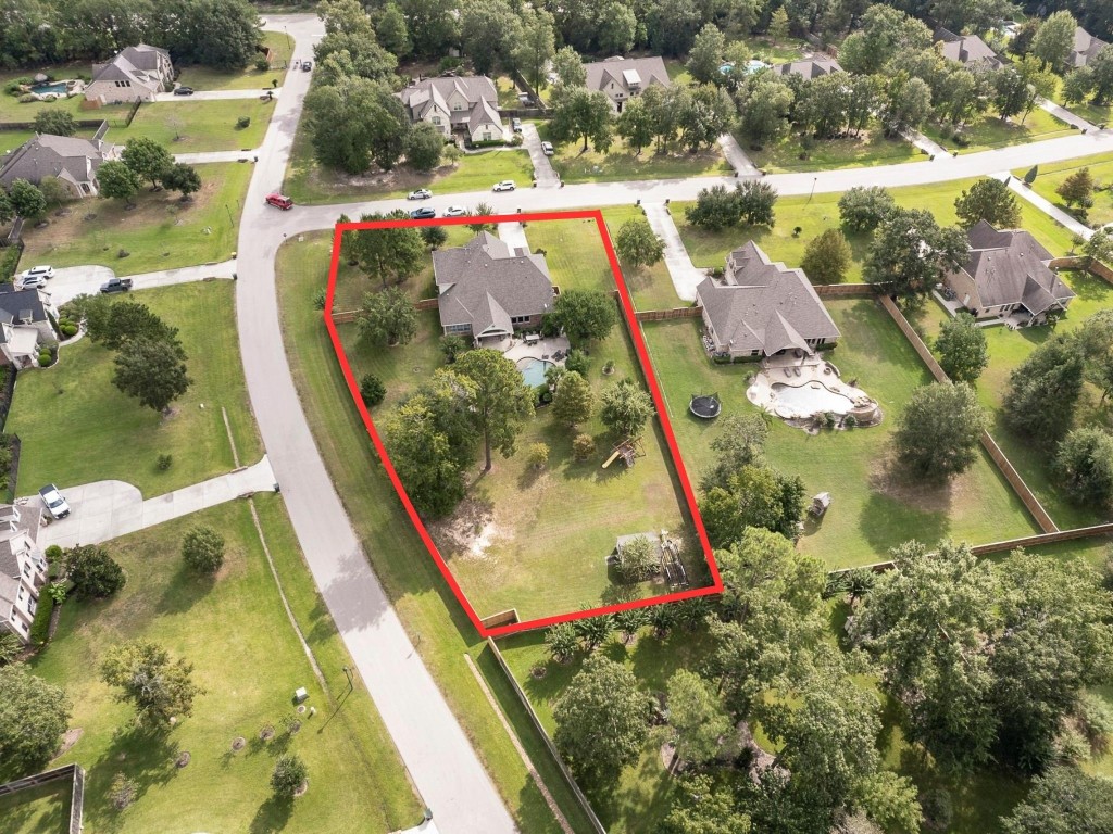 2600 Silverstone Way Conroe, TX 77304 - Photo 49 of 49 an aerial view of residential houses with outdoor space
