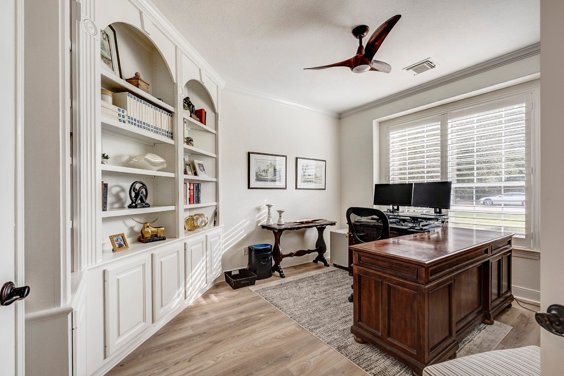 2600 Silverstone Way Conroe, TX 77304 - Photo 6 of 49 Behind stately double doors awaits a quiet executive retreat — polished, private, and perfectly positioned for productivity.