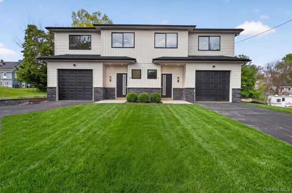 a house view with a garden space