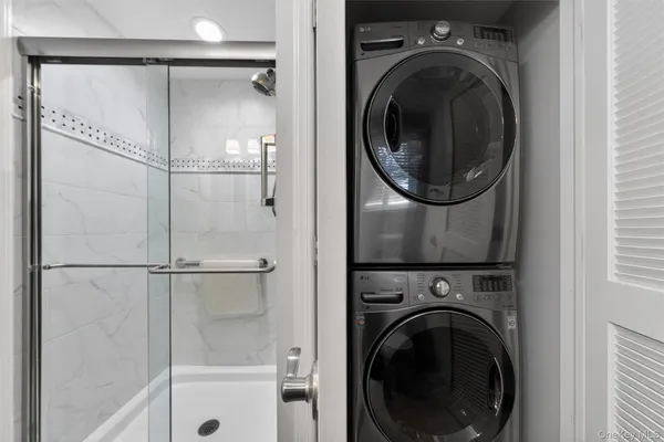 a view of a hallway with washer and dryer