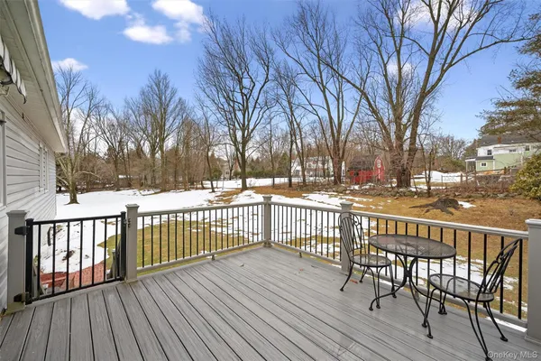 a view of a wooden deck with trees