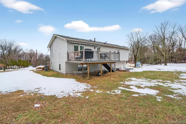 a view of a house with snow on the background