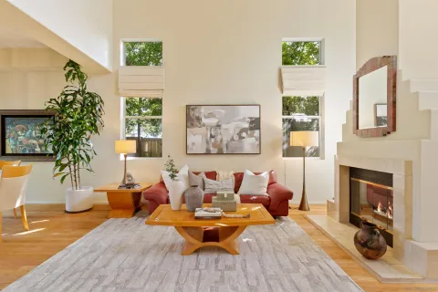 a porch with potted plants and couches