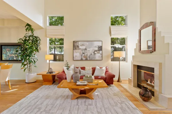 a porch with potted plants and couches