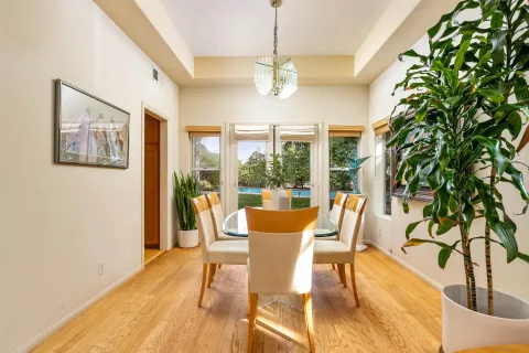 a large kitchen with stainless steel appliances granite countertop a sink and cabinets