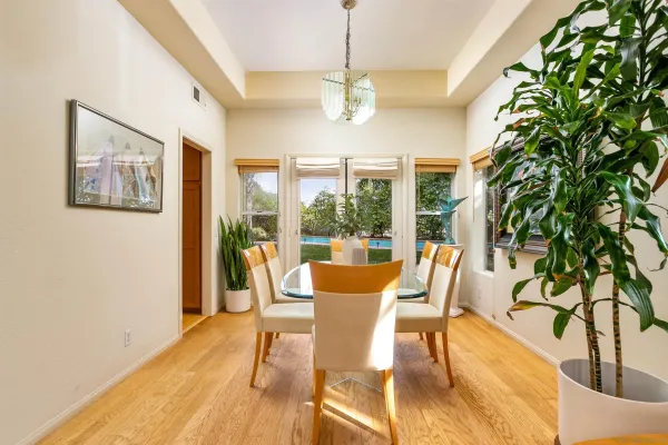 a large kitchen with stainless steel appliances granite countertop a sink and cabinets