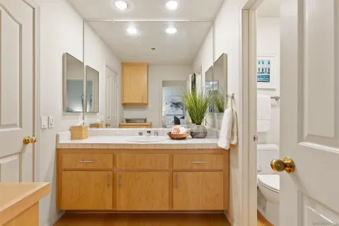 a view of a balcony with furniture and lots of wooden floor