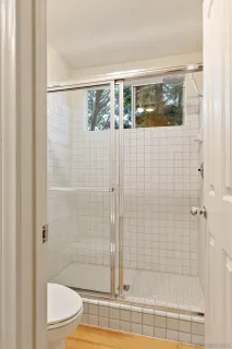 a bedroom with bed and a window