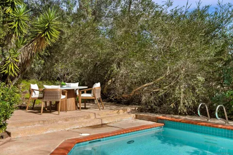 a view of a house with a yard and porch