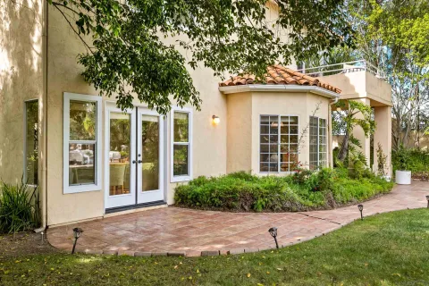 a view of a chair and table in the garden