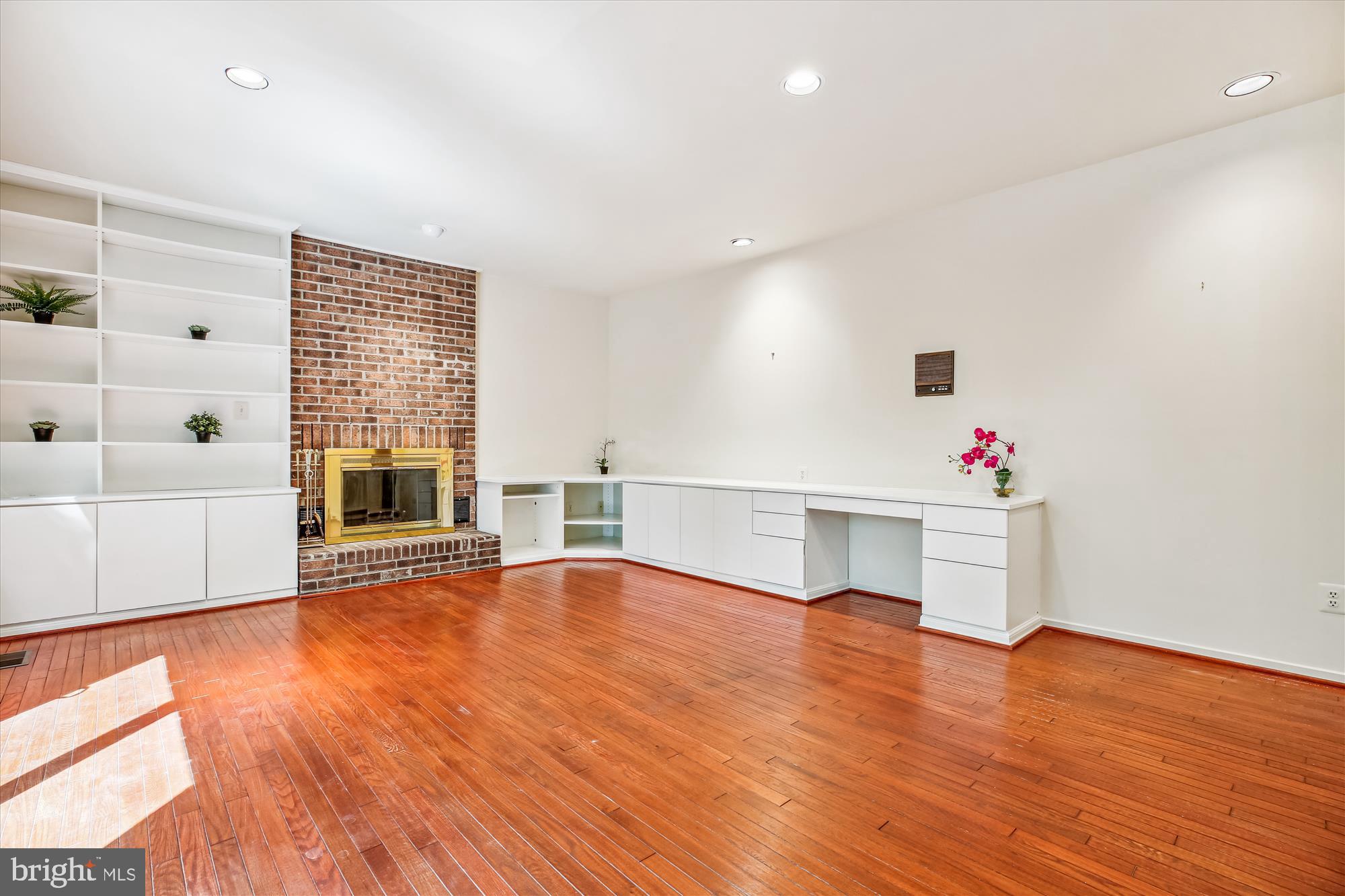 7922 Springer Road Bethesda, MD 20817 - Photo 14 of 58 Family Room with Built-Ins and a Fireplace