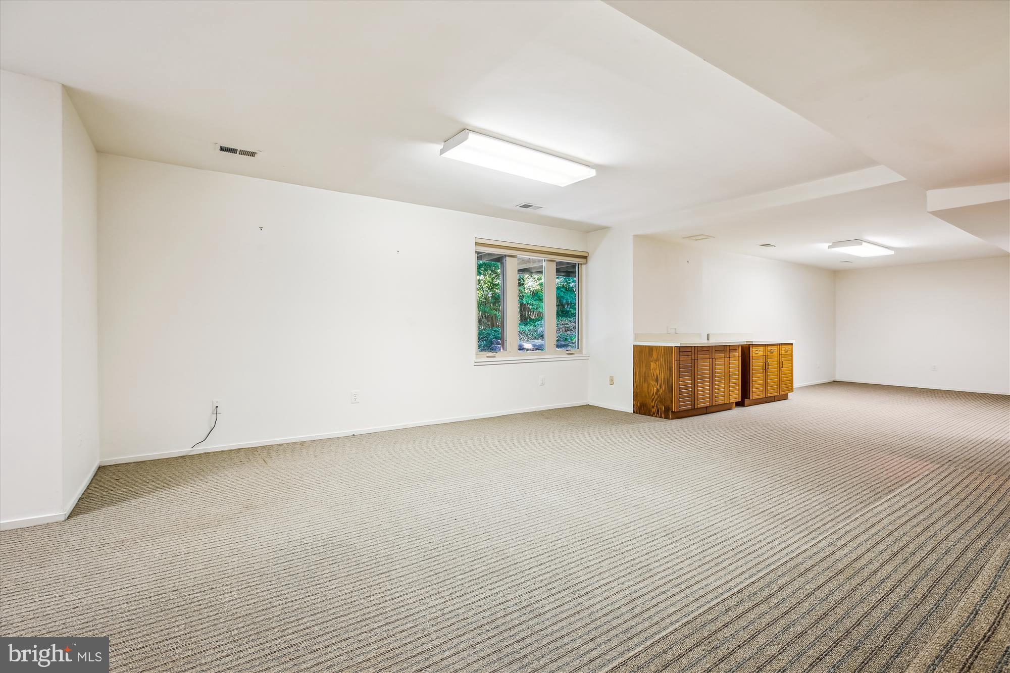 7922 Springer Road Bethesda, MD 20817 - Photo 41 of 58 Recreation Room with Nice Natural Light