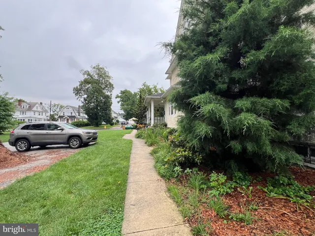 a view of a garden with houses