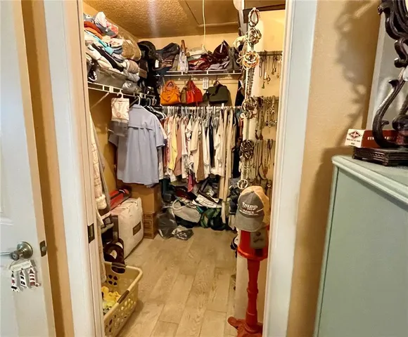 a view of a closet with storage