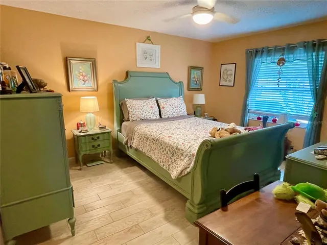 a bedroom with a bed and a dresser