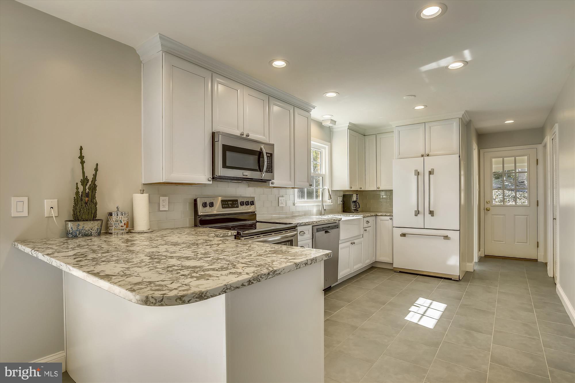 7107 Devonshire Road Alexandria, VA 22307 - Photo 7 of 42 New kitchen w/ quartz counters and recessed lights