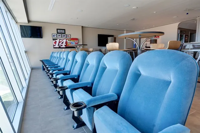 a view of a livingroom with furniture and chandelier