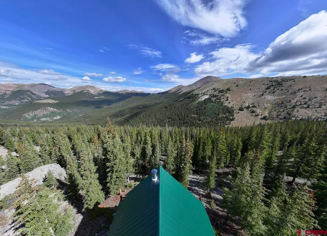 a view of a yard with a mountain