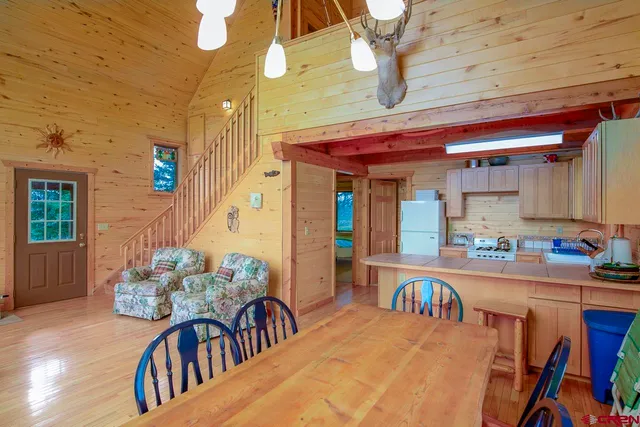 a kitchen that has a sink and a refrigerator
