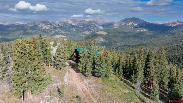 a view of a lake in between two of trees