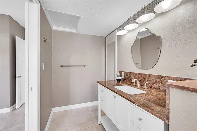 a view of a house with swimming pool and view of a lake