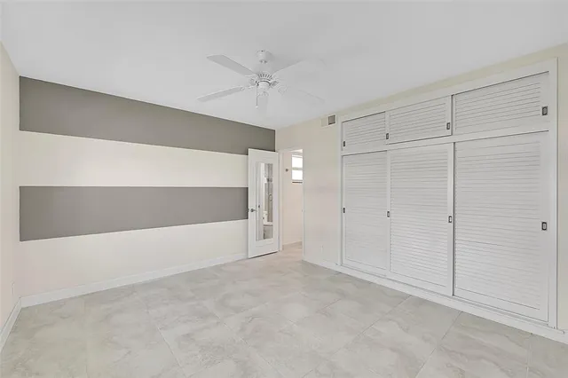 a swimming pool with outdoor seating and yard