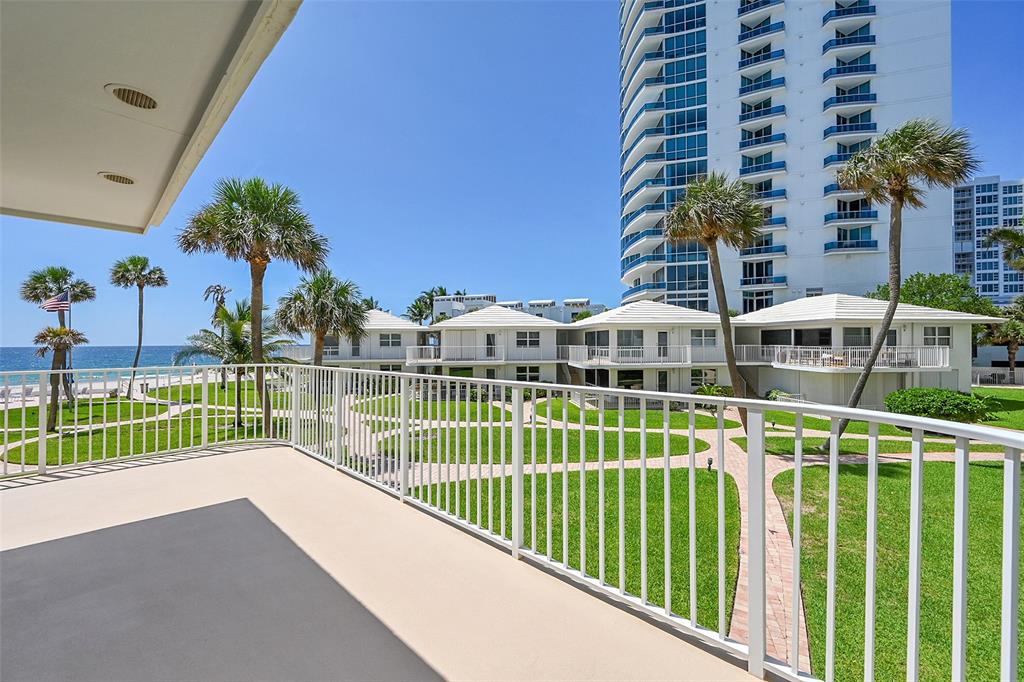 1530 South Ocean Boulevard, Unit 12 Lauderdale-by-the-Sea, FL 33062 - Photo 5 of 81 a view of building with a small yard