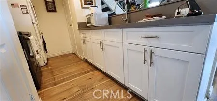 a bathroom with a sink a mirror and shower