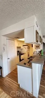 a kitchen with stainless steel appliances a stove a sink and a refrigerator