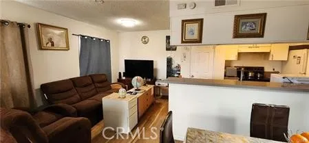 a living room with furniture fireplace and a flat screen tv