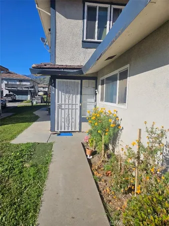 a front view of a house with a yard and a garage