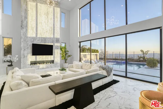 a kitchen with stainless steel appliances kitchen island granite countertop a sink and cabinets