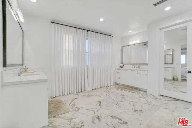 a bedroom with a bed and a television