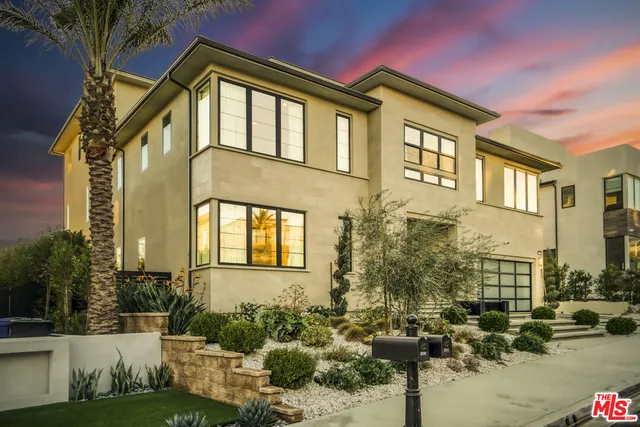 a front view of a house with a swimming pool