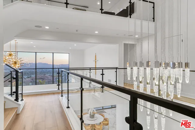 a bathroom with a sink mirror vanity and toilet