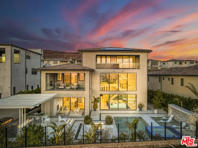 a balcony with furniture and a potted plant