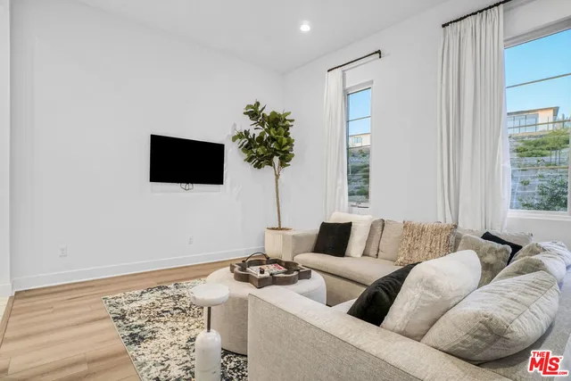 a view of swimming pool with outdoor seating and plants