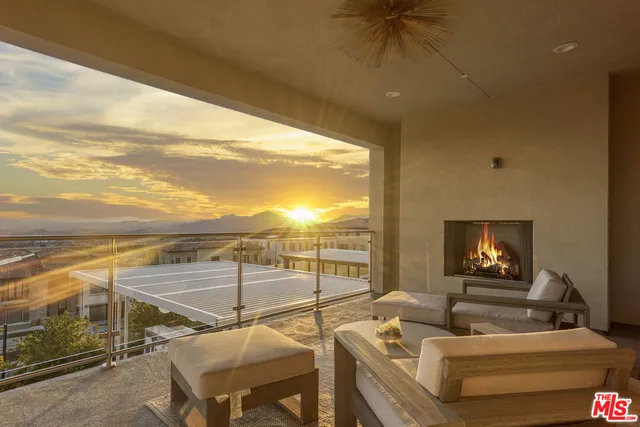 a view of a balcony with furniture