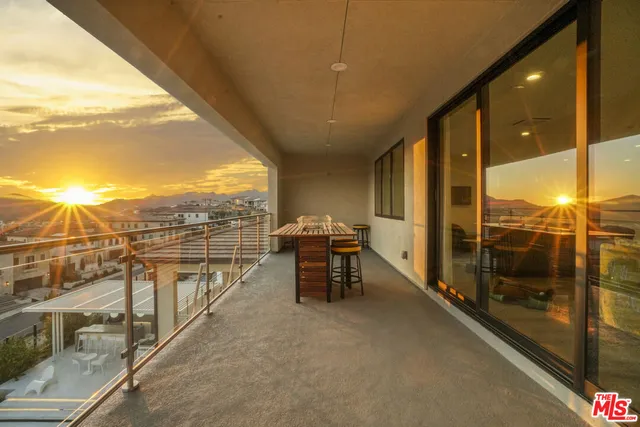 a view of a backyard with table and chairs