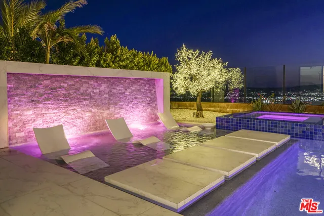 a view of a swimming pool with a patio