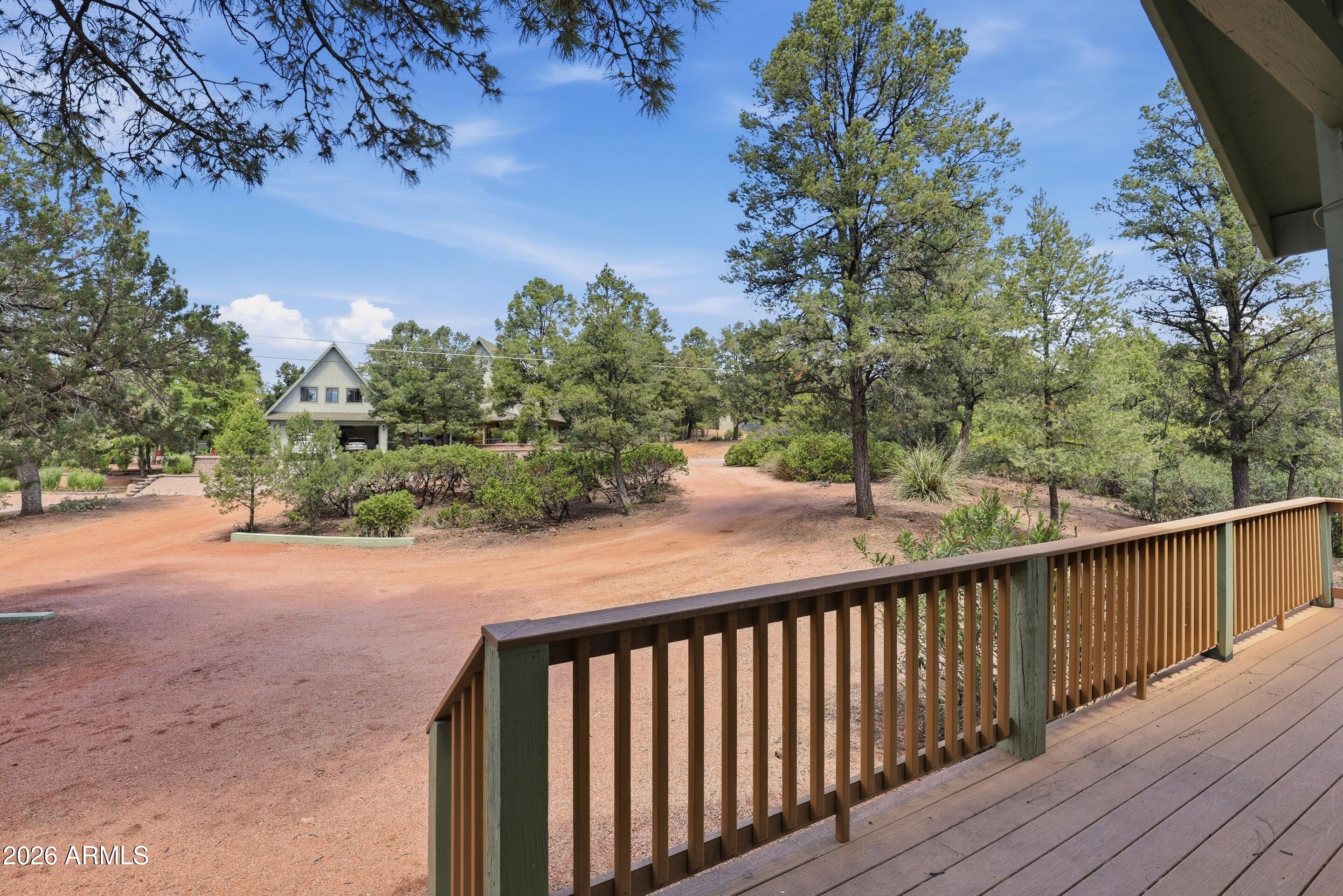 1405 East Graham Rnch Trail Payson, AZ 85541 - Photo 41 of 46 a balcony with wooden floor and trees