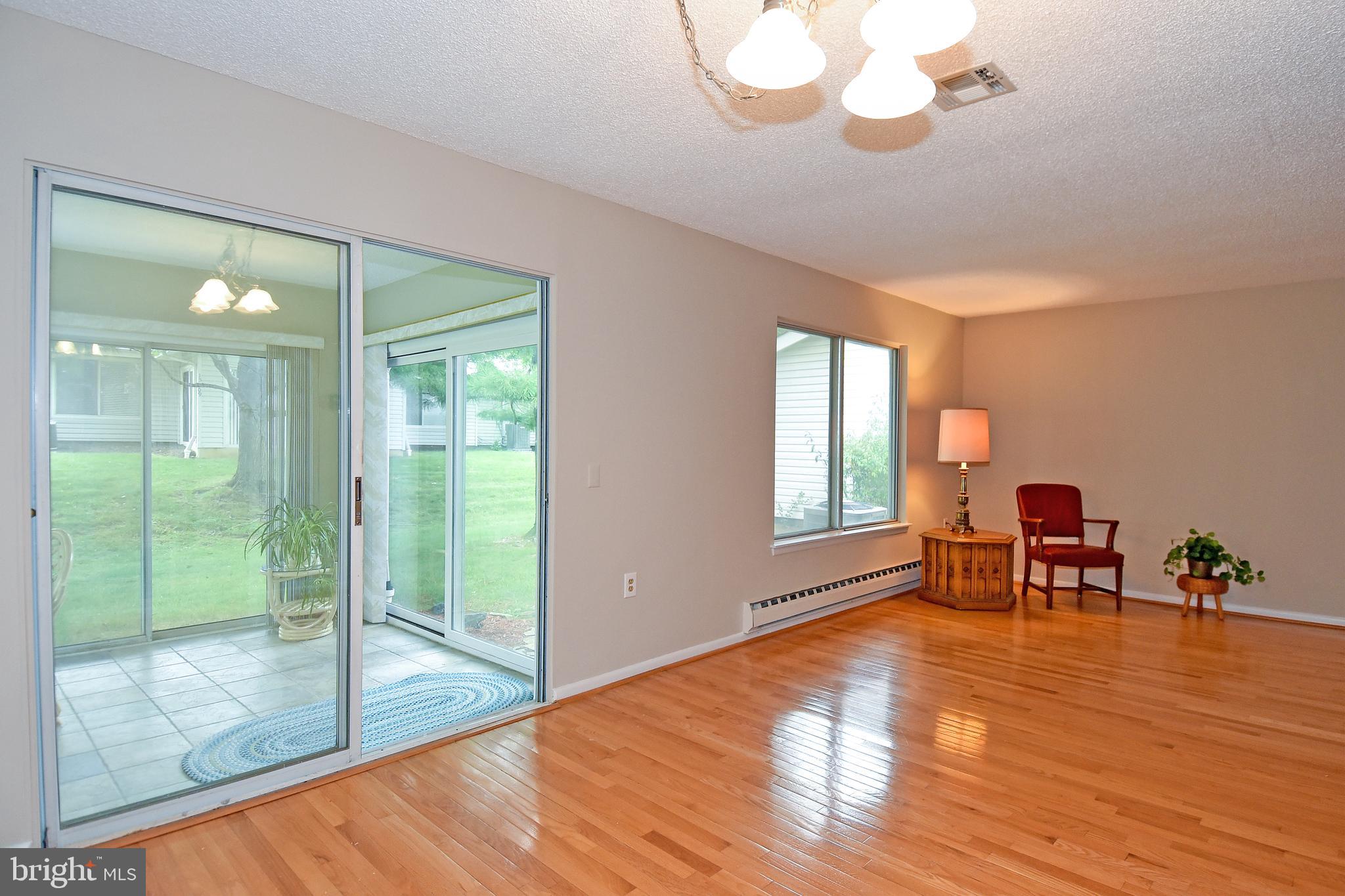 3306 Solomons Court, Unit 99A Silver Spring, MD 20906 - Photo 15 of 52 Living Romm / Dining Room / Four Season Sun