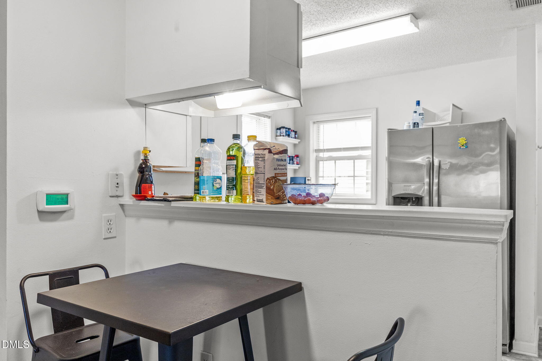 1305 Kent Road, Unit 101 Raleigh, NC 27606 - Photo 7 of 29 a kitchen with a table and chairs in it