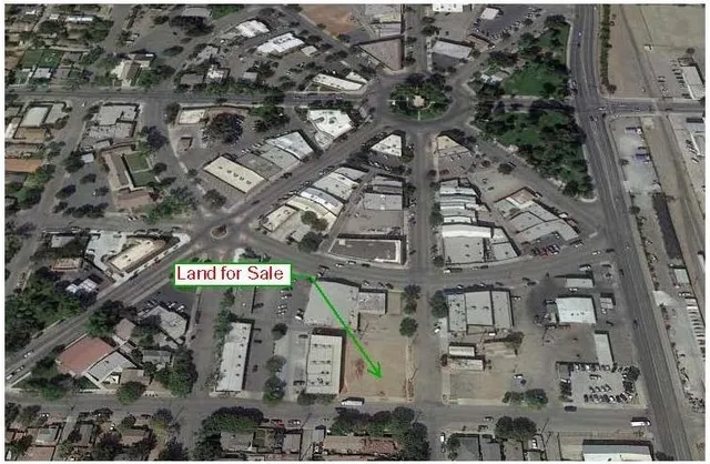 an aerial view of a building with yard