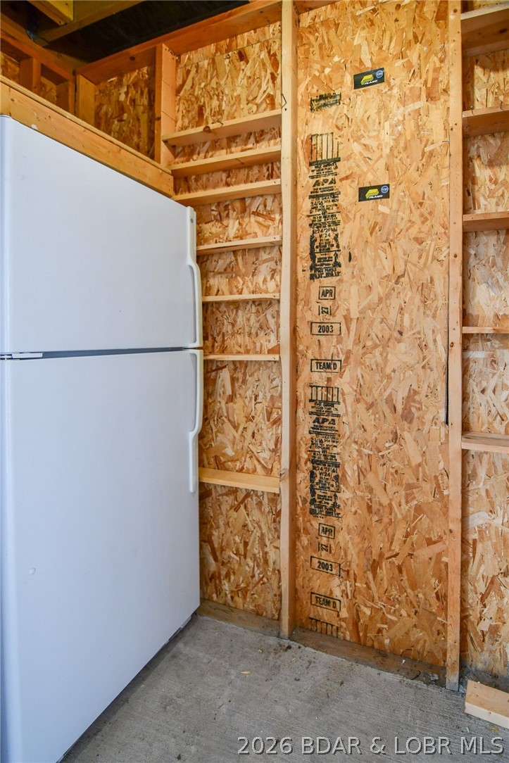 194 Sac Road, Unit D301 Sunrise Beach, MO 65079 - Photo 14 of 43 Fridge and storage space for your lake toys