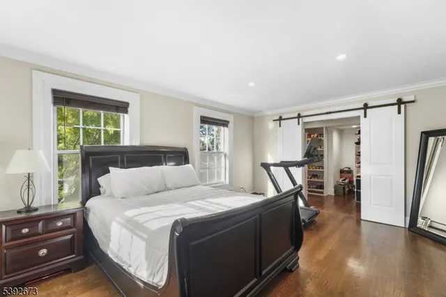 a bed room with a bed and a dresser